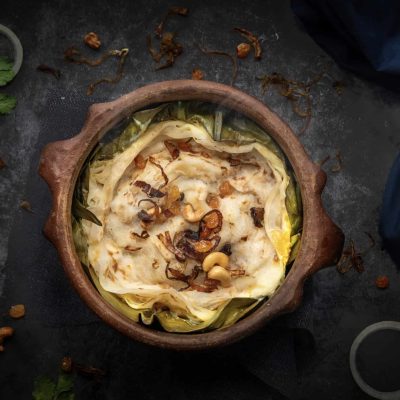 Kerala biryani garnished with fried onions and cashews